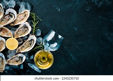 Fresh oysters with ice and white wine. Seafood. Top view. Free copy space.