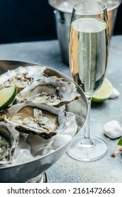 Fresh oysters with lemon and ice. Restaurant delicacy. oysters dish. Oyster dinner with champagne in restaurant. menu, dieting, cookbook recipe.