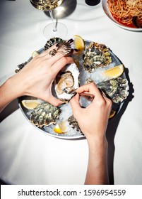 fresh oysters, Mediterranean cuisine, girl eats, oysters on ice