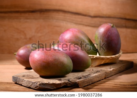 Fresh palmer mango on wooden background, Tropical fruit