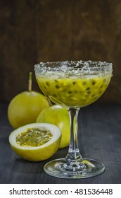 Fresh passion fruit juice in glass with passion fruits over wooden background , still life - Shutterstock ID 481536448