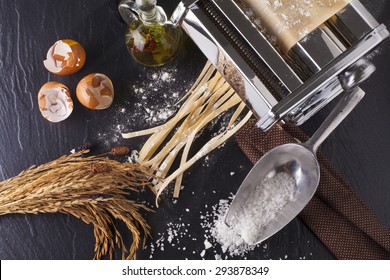 Fresh Pasta Making Of Homemade Fresh Pasta Tagliatelle With Egg And Flour Overhead Angle