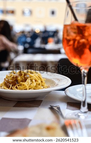  Fresh pasta   spaghetti cacio e pepe and Aperol Spritz  at  typical italian resaturant at Trastevere   neighbourhood at Rome 