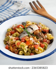 Fresh pasta with vegetables and sardines. - Shutterstock ID 2365385823
