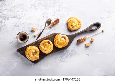 Fresh Pastry Sweet Swirl Buns With Raisins On Wooden Board For Breakfast Or Brunch And Coffee. Party Food Concept. Top View, Copy Space.