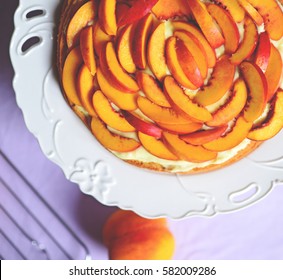 Fresh peach cake on table