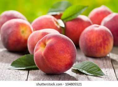 Fresh Peaches On Wooden Table