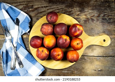 Fresh Peaches Wooden Board With Blue Plaid Napkin