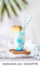 A Fresh Pinapple Flavoured Tropical Cocktail On White Background