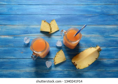 Fresh Pineapple And Mango Cocktail In Glasses On A Blue Rustic Wooden Background, Copy Space. Fresh Cold Pinapple And Mango Juice For Summer