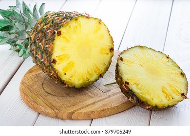 Fresh Pineapple on Light White Wooden Background, Close-up