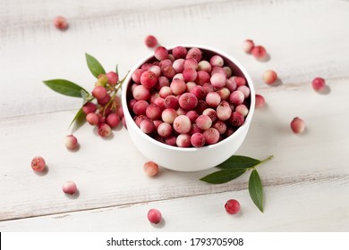 Fresh Pink Lemonade Blueberries In Bowl On White Wooden Table