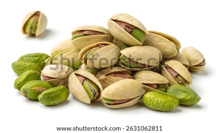 fresh pistachio nuts with their shells slightly open, revealing vibrant green kernels inside.