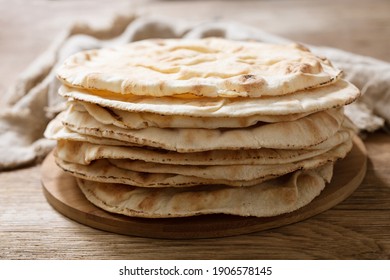 Fresh Pita Bread On A Wooden Board