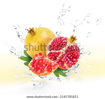 Fresh Pomegranate fruit falling in the air with splash water isolated on white background, Pomegranate fruit on white background With clipping path.