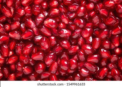 A lot of fresh pomegranate seeds viewed from above