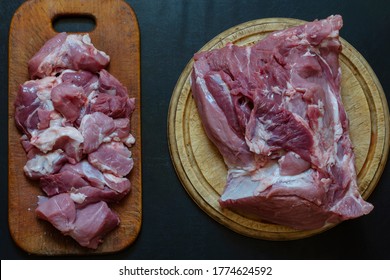 Fresh Pork Tenderloin On A Cutting Board. Whole Raw Sacrum And Pork Goulash. Trade In Meat Or Cooking Meat Dishes.