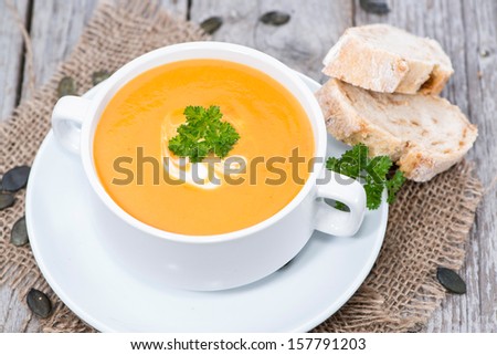 Similar – Foto Bild Kürbissuppe in weißer Schüssel und Zutaten auf Holztisch