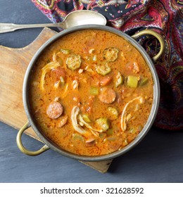 A Fresh Pot Of Gumbo On A Cutting Board. 