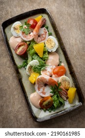 Fresh Prawn And Egg Salad On Rustic Wood Table