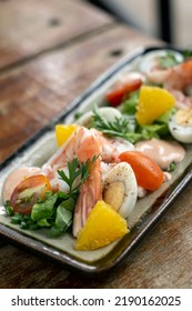 Fresh Prawn And Egg Salad On Rustic Wood Table