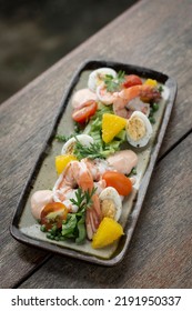 Fresh Prawn And Egg Salad On Rustic Wood Table