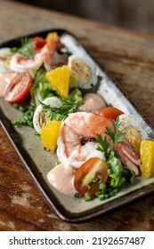 Fresh Prawn And Egg Salad On Rustic Wood Table