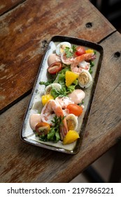 Fresh Prawn And Egg Salad On Rustic Wood Table