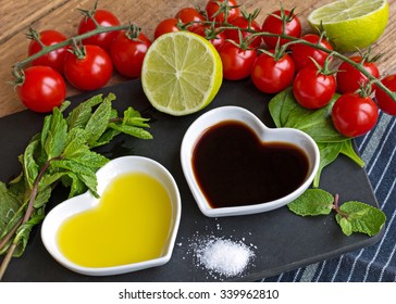 Fresh products to make a healthy salad dressing with olive oil and balsamic vinegar