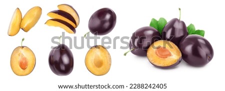 fresh purple plum and half isolated on white background . Top view. Flat lay. Set or collection.