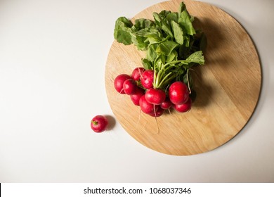 fresh radish on the wood cutting board  - Shutterstock ID 1068037346
