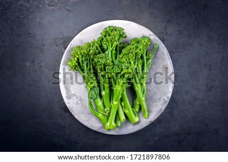 Fresh rapini broccoli rabe as top view on a gray plate with copy space  Foto stock © 