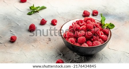 Fresh raspberries in bowl. Ripe juicy fresh raspberries. Organic raspberries, healthy food, vitamins, summer berry fruit. Long banner format. place for text.