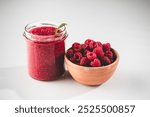 Fresh Raspberries: Juicy, Ripe Berries for a Healthy Summer Snack on a white background.