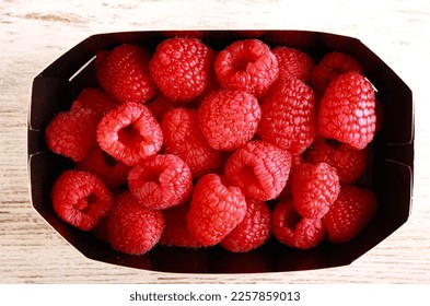 Fresh raspberry in box, close up