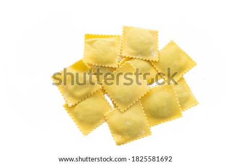 Fresh Ravioli pasta golden color isolated on white background, top view