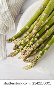 fresh raw asparagus on a white . High quality photo