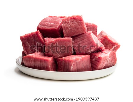 Fresh  raw beef in ceramic plate isolated on white 