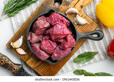 Fresh Raw Beef Cubes Set, On White Stone Surface, Top View Flat Lay