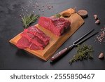 Fresh raw beef meat to make delicious juicy steak with spices and herbs. Preparation for grilled meat