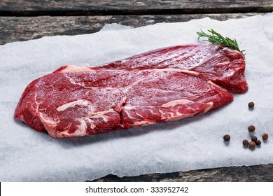 Fresh Raw Beef Rump Steak On Crumpled Paper.