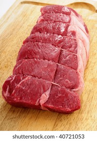 Fresh Raw Beef Steak Roast On A Wooden Butchers Block Cutting Board