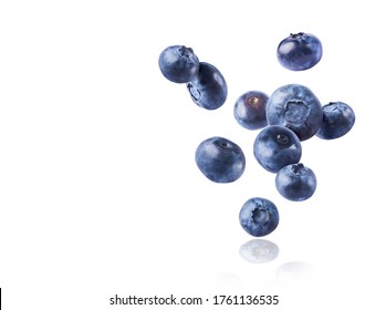 Fresh raw blueberries falling in the air isolated on the white background. Food levitation concept. High resokution image