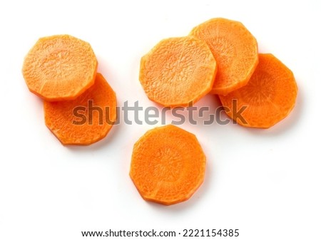 fresh raw carrot slices isolated on white background, top view
