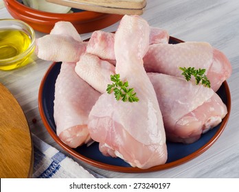 Fresh Raw Chicken Legs On A Plate. 