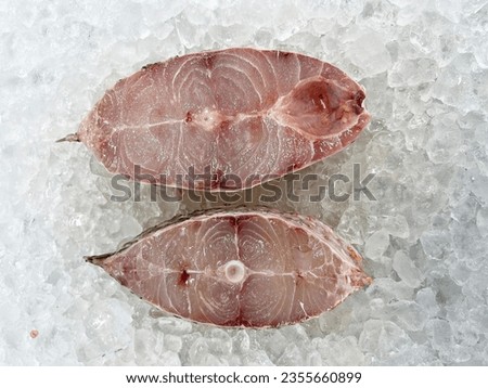 fresh raw cold seafood green color snapper whole fish ikan head, fillet, meat, cut, tail on white ice background halal food cuisine hyper market menu for restaurant ingredient design