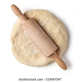 fresh raw dough and rolling pin isolated on white background, top view