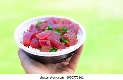 Fresh Raw Fish Poke Bowl On Bed Of Rice 