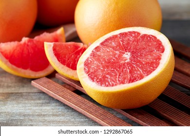 Fresh raw grapefruit (citrus x paradisi) on wooden background