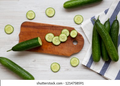 Fresh Raw Green Cucumbers, View From Above. Flat Lay, Overhead, Top View. White Wooden Background.